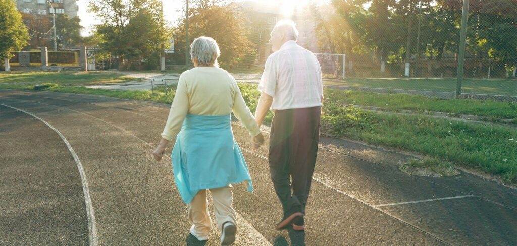Elderly couple walking on a track