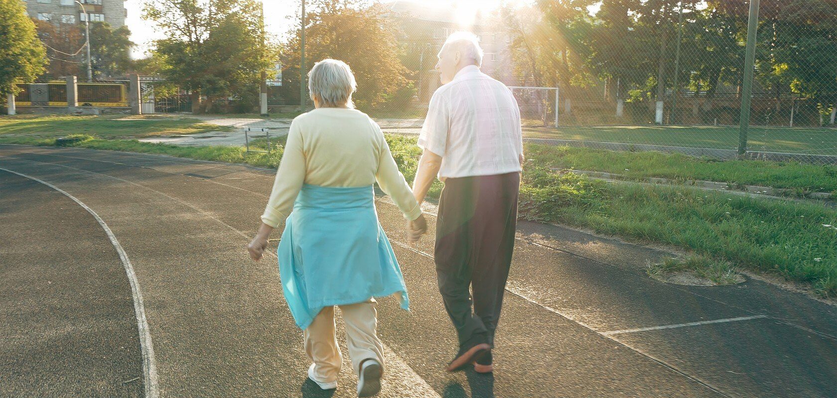 Elderly couple walking on a track