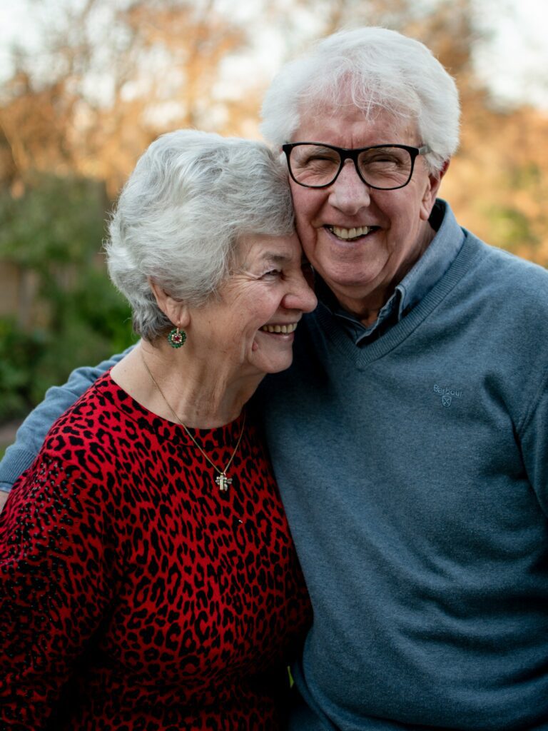 Older couple smiling for a photo